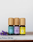 Prime Potion Pure Essential Oil Set of 3:  peppermint, lavender, and lemon in 10 mL vials with bamboo wood tops.