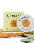 Lemongrass and orange essential oil REVIVE everything lips, hands, skin salve shown in tin in front of box.