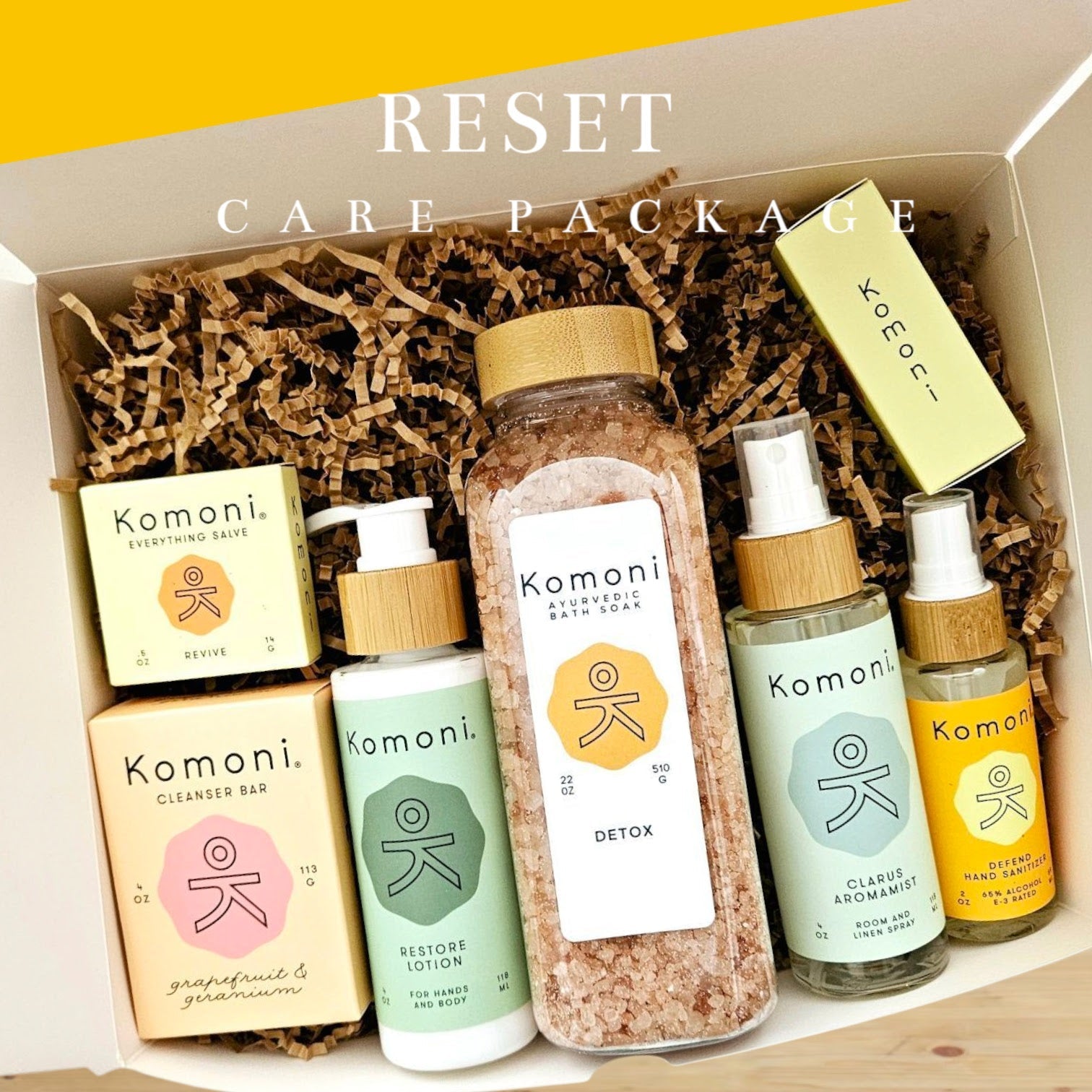 A beautiful display of of some of Komoni's offerings of aromamists, salves, essential oils, bath soaks, and cleanser bars, shampoo bars, and hand sanitizers.