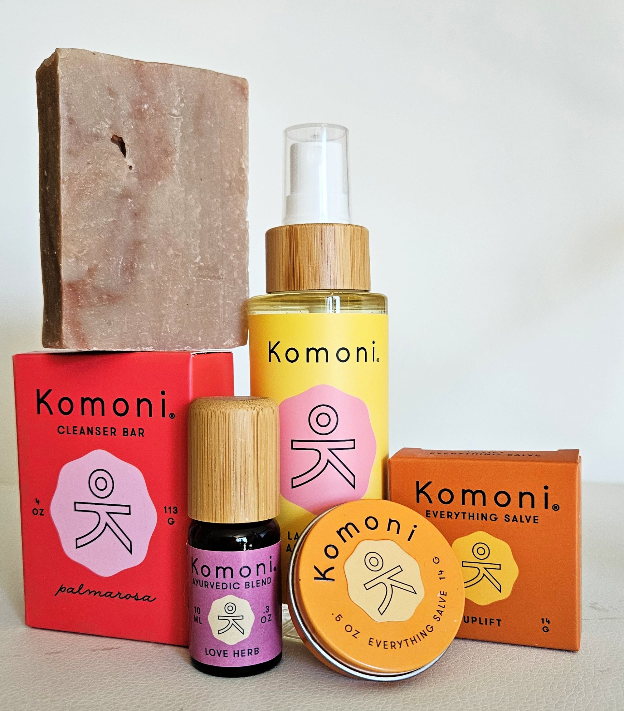 A partial selection of Komoni's holistic self-care products rooted in connection and thoughtful living.