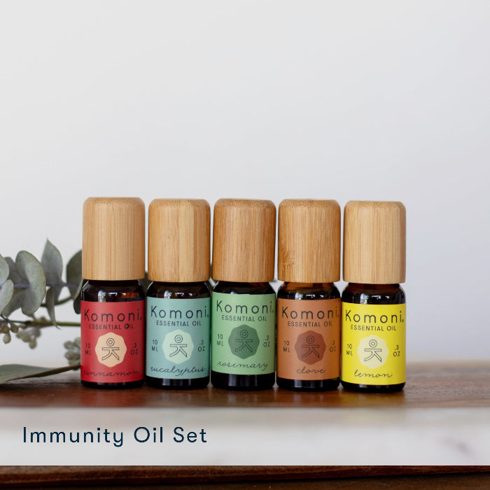 Immunity Pure Essential Oil Set of 5: Cinnamon, eucalyptus, rosemary, clove, and lemon in 10 mL vials with bamboo wood tops. 